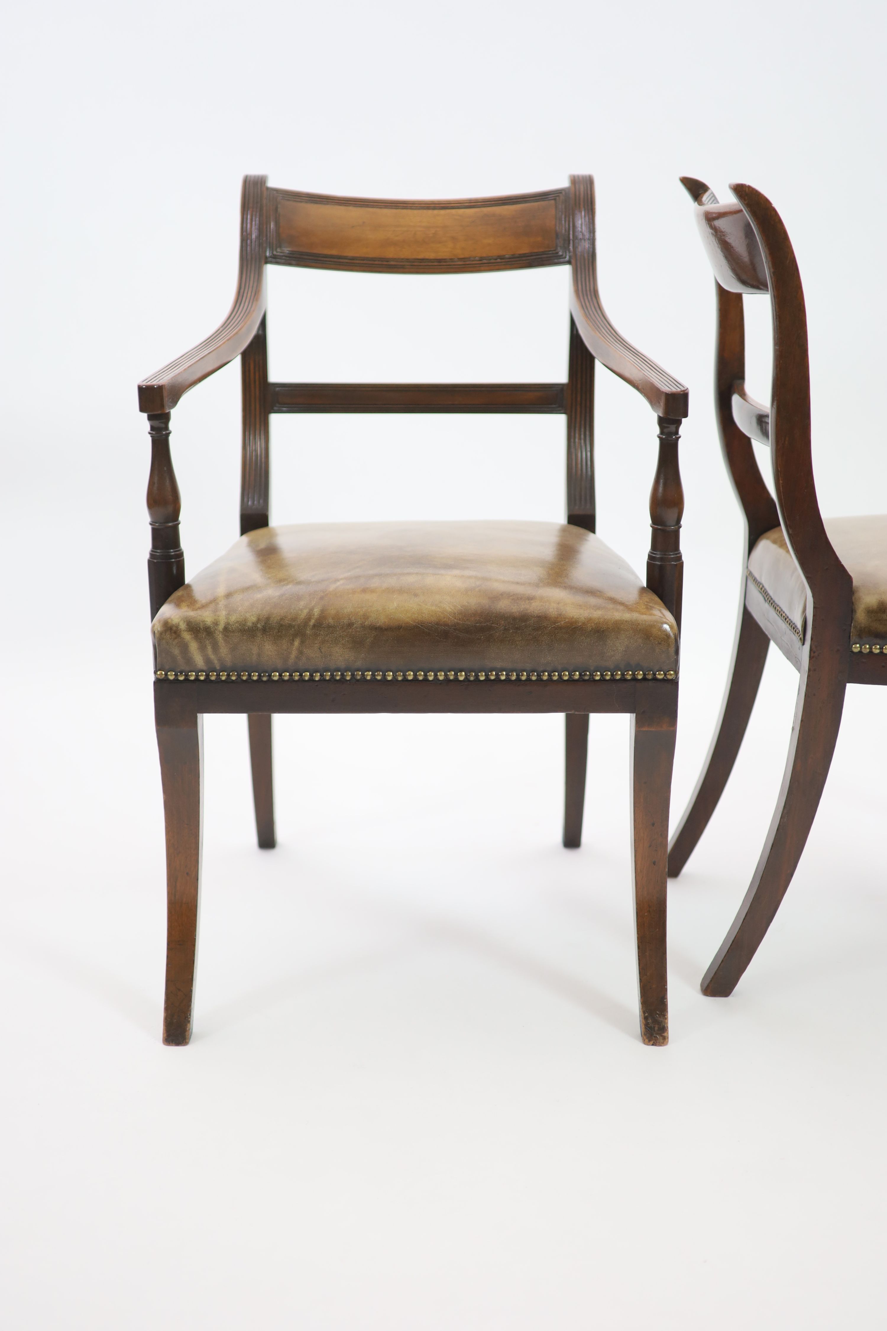 A set of fourteen Regency and later mahogany dining chairs, including two carvers, carvers W.58cm H.89cm